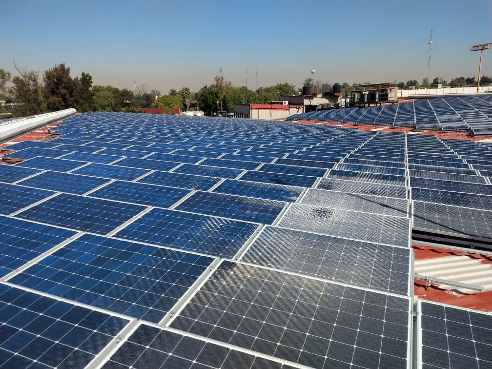 A large commercial rooftop covered edge to edge in solar panels