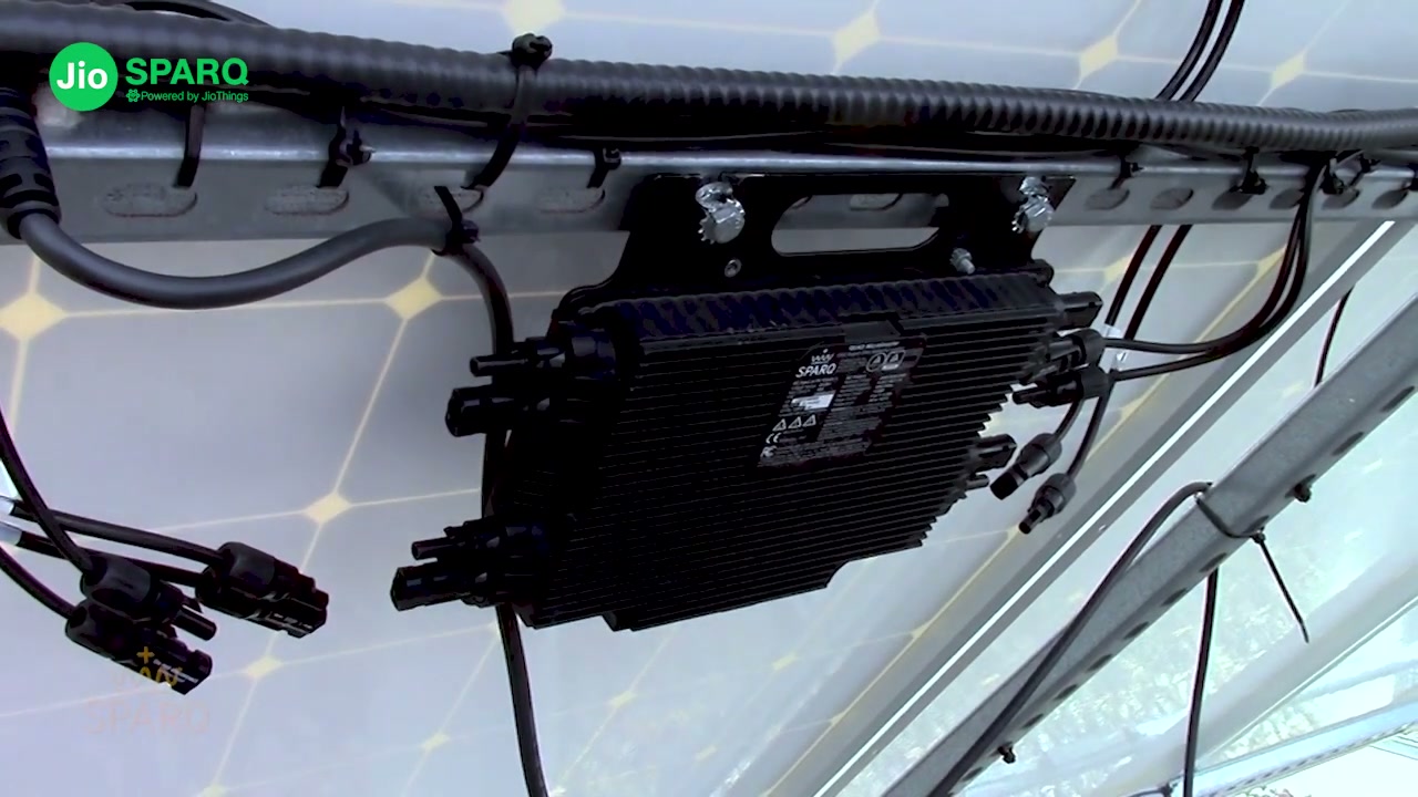 Sparq Quad mounted under a live panel, MC4 leads landed
